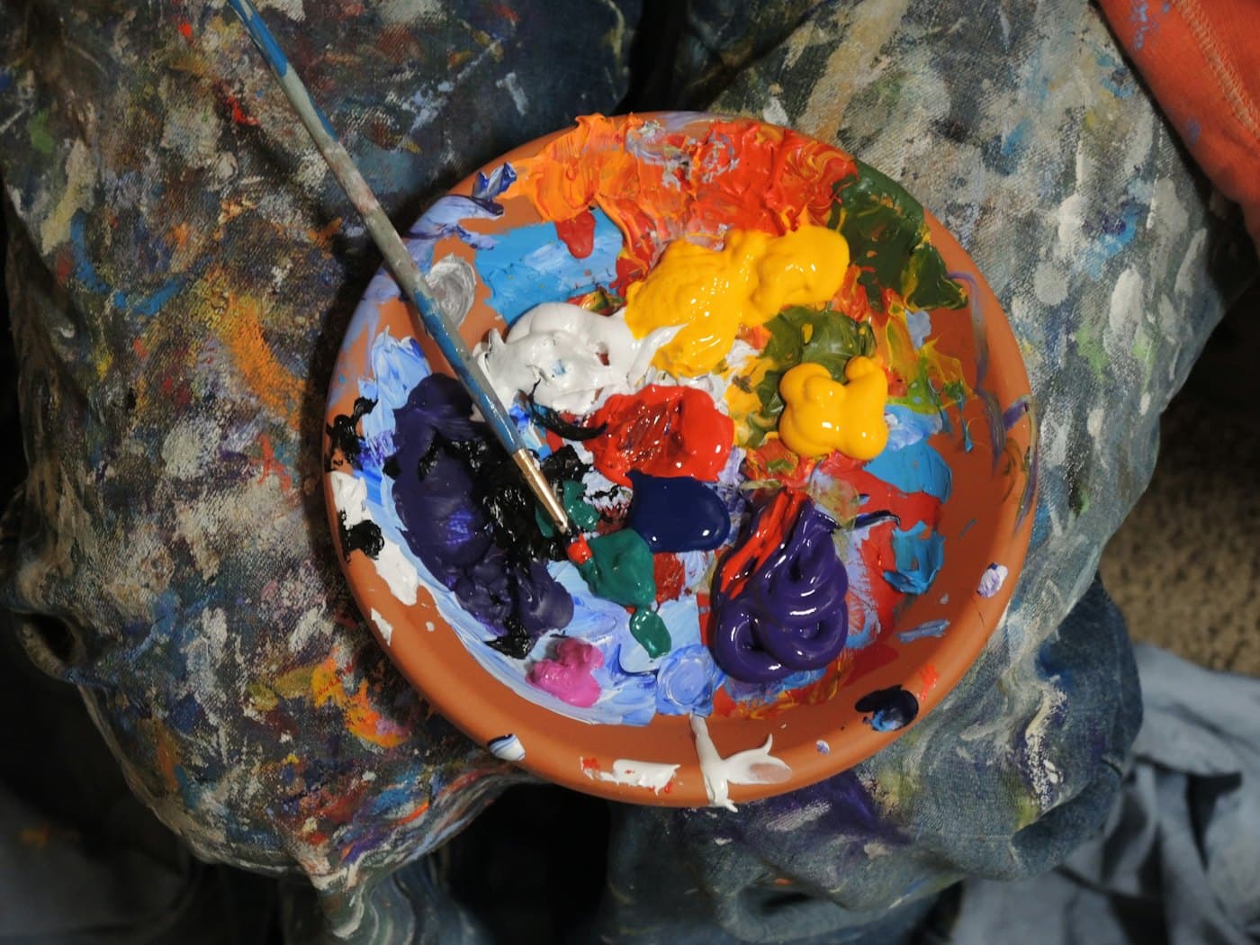 Artist's palette crowded with mixed paint