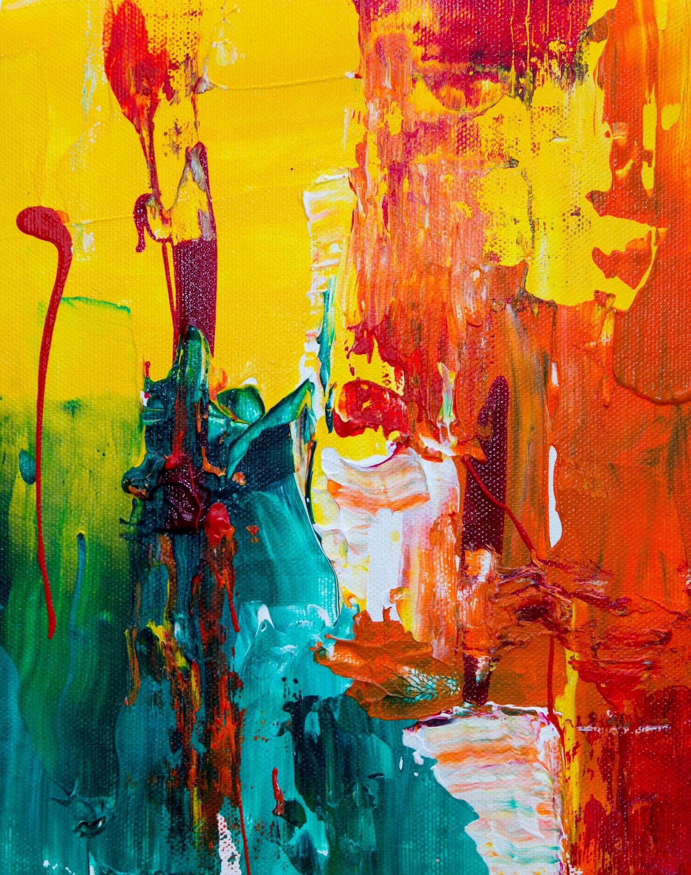 Abstract canvas of thick yellow, red and teal brushstrokes